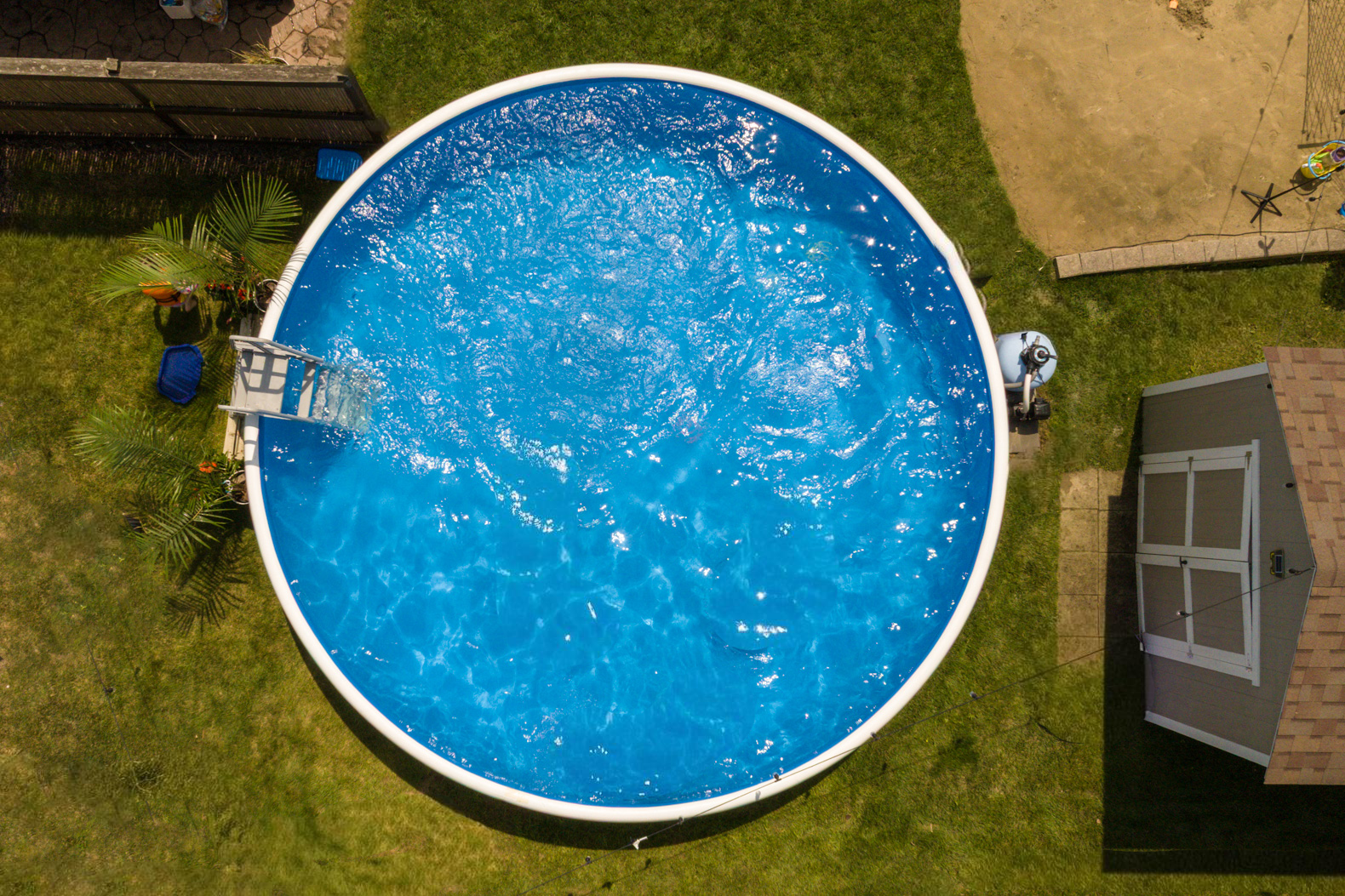 Aerial view of a round above-ground Perfect Pool in a backyard.